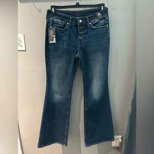 NWT Silver jeans size 30x33. Button fly. Suki curvy fit mid rise flare leg.